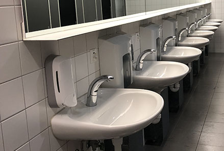  Traditional sinks in an airport washroom.